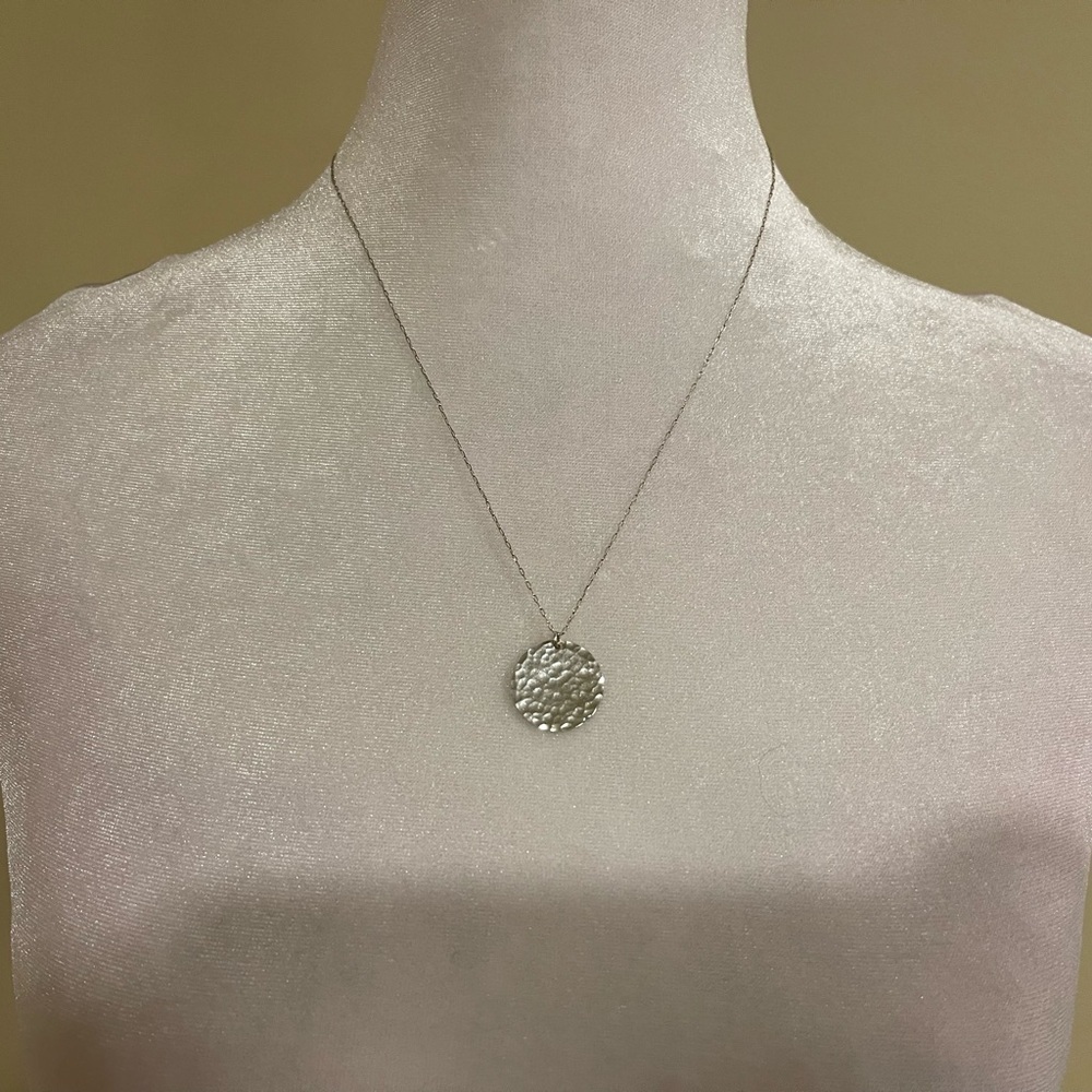 Silver toned disc necklace​​​​​​​​​